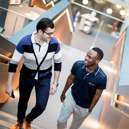 Two students chatting at an open day -essex