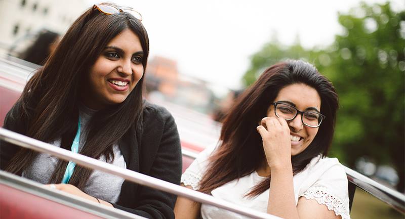 Two women in an open-top bus-essex