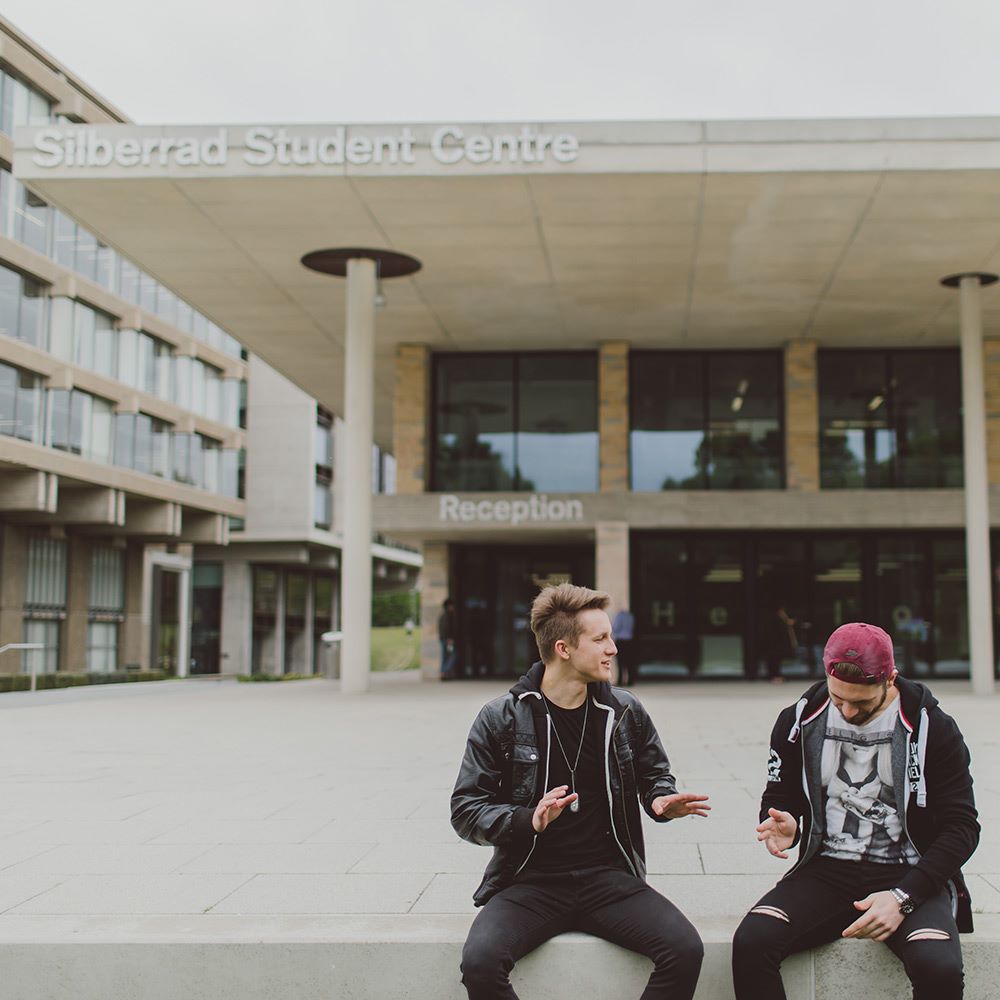 Students sitting outside student centre -essex